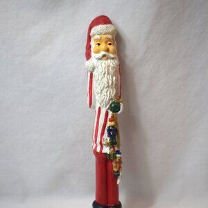Vintage Resin Skinny Santa Claus Figure With Black Boots and Toys